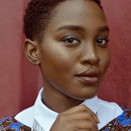 Woman with natural hair smiling brightly